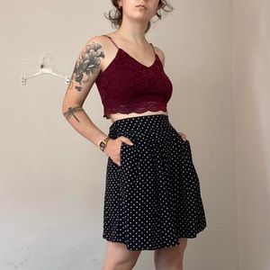 Black short culottes with small white polkadots size small